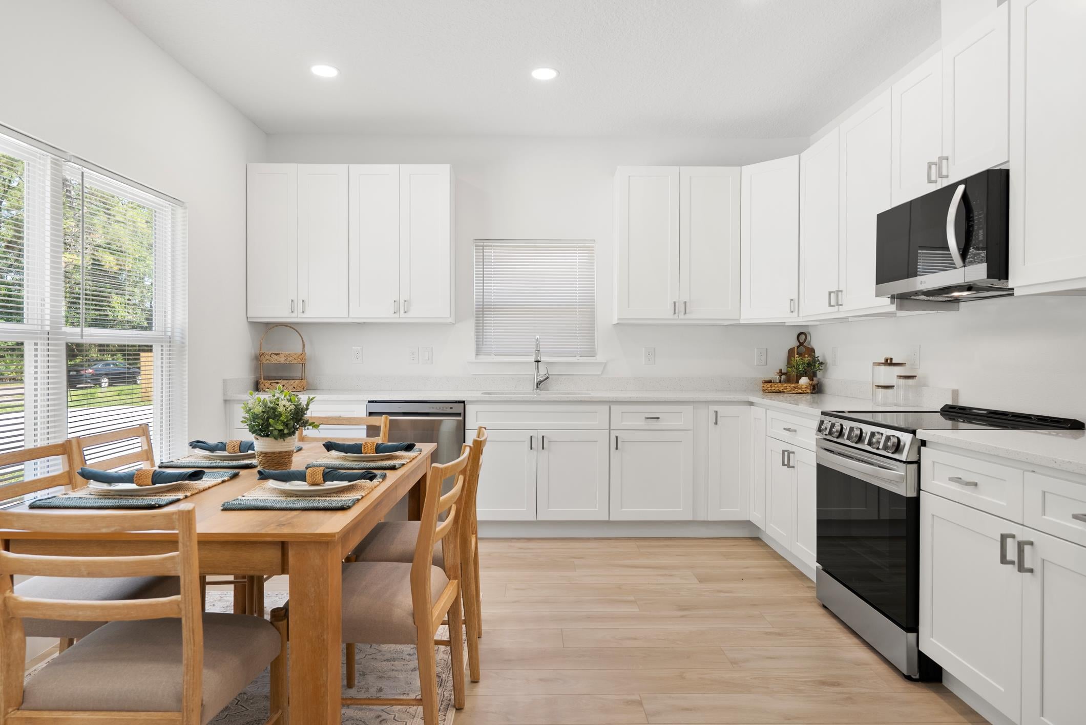 Eat-in kitchen with dining table and modern appliances