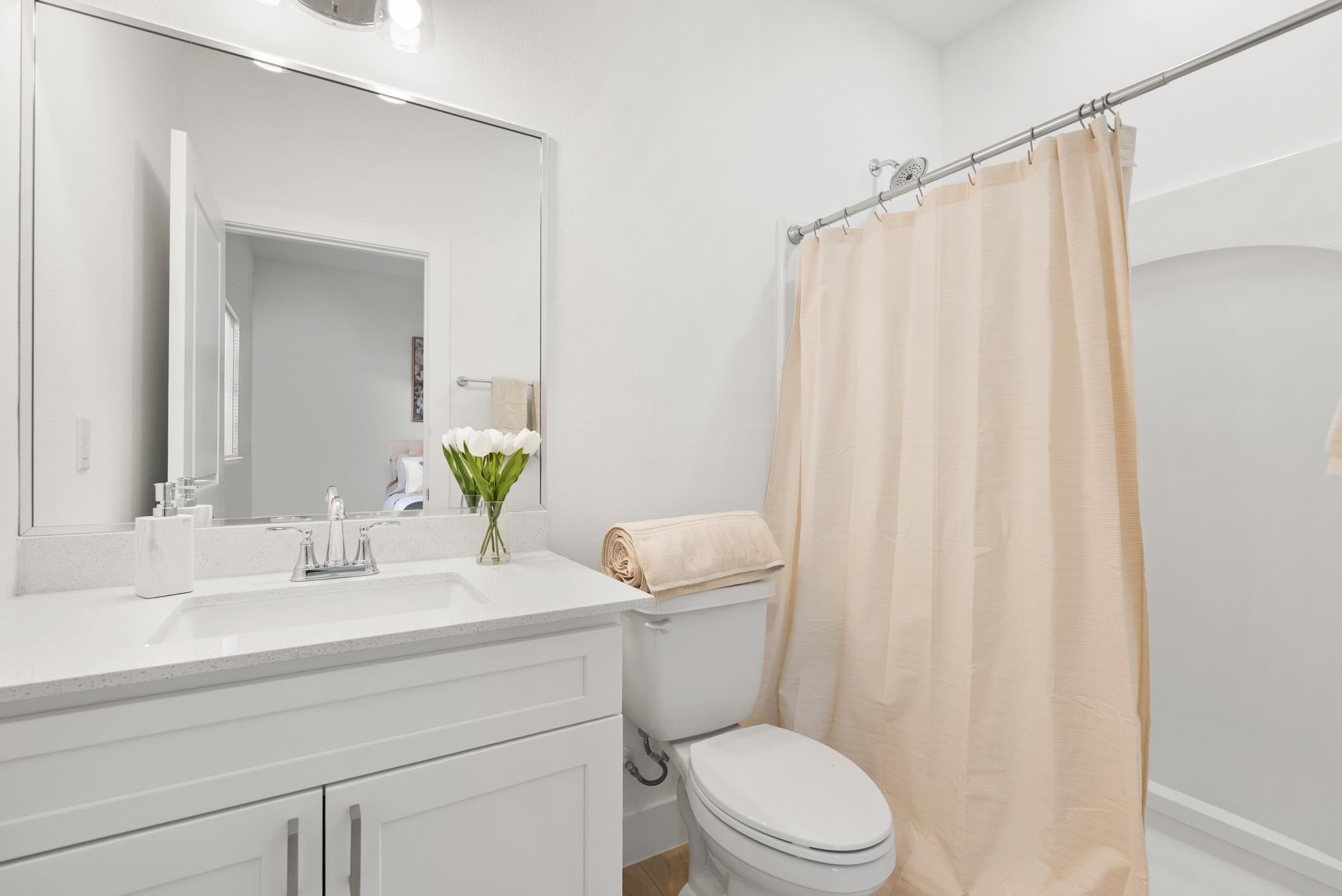 En suite bathroom with vanity and shower