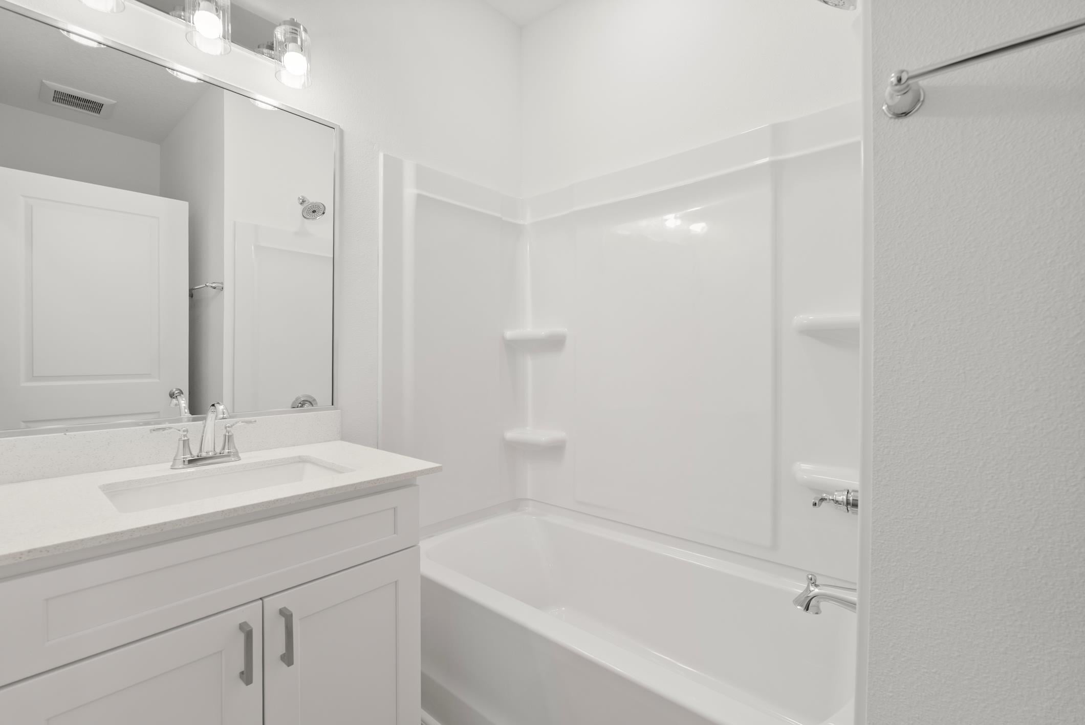 Bathroom with tub and shower combination