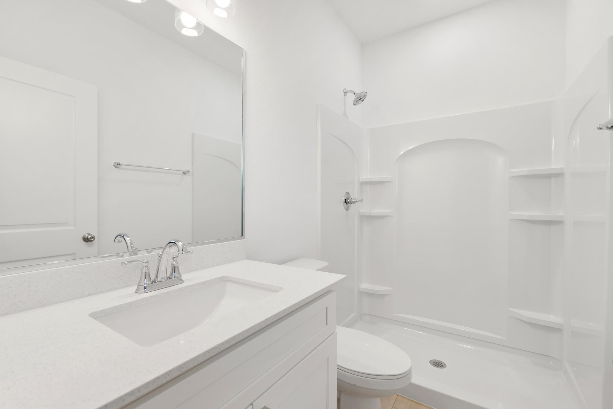 Bathroom with vanity and walk-in shower