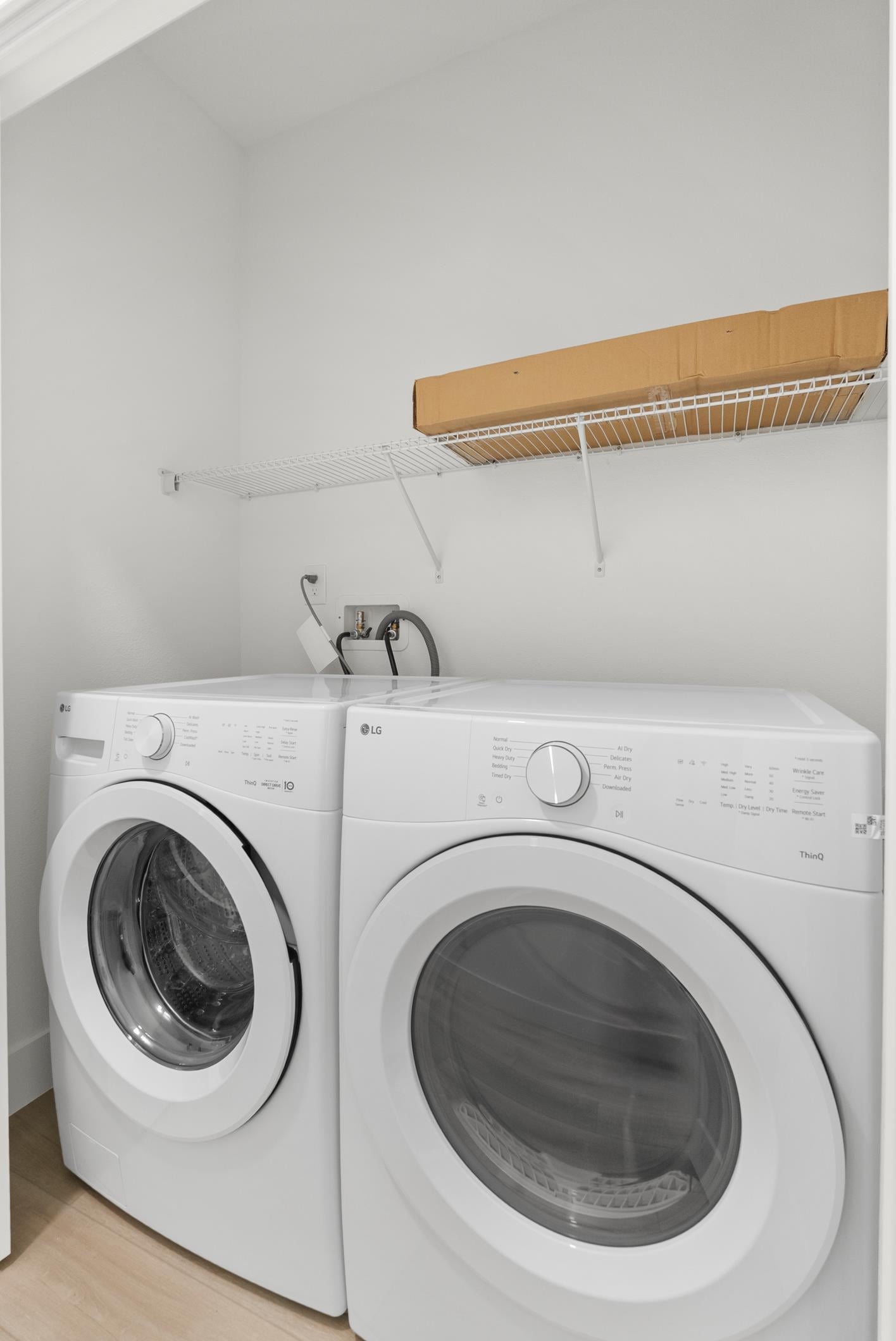 In-home laundry room with washer and dryer