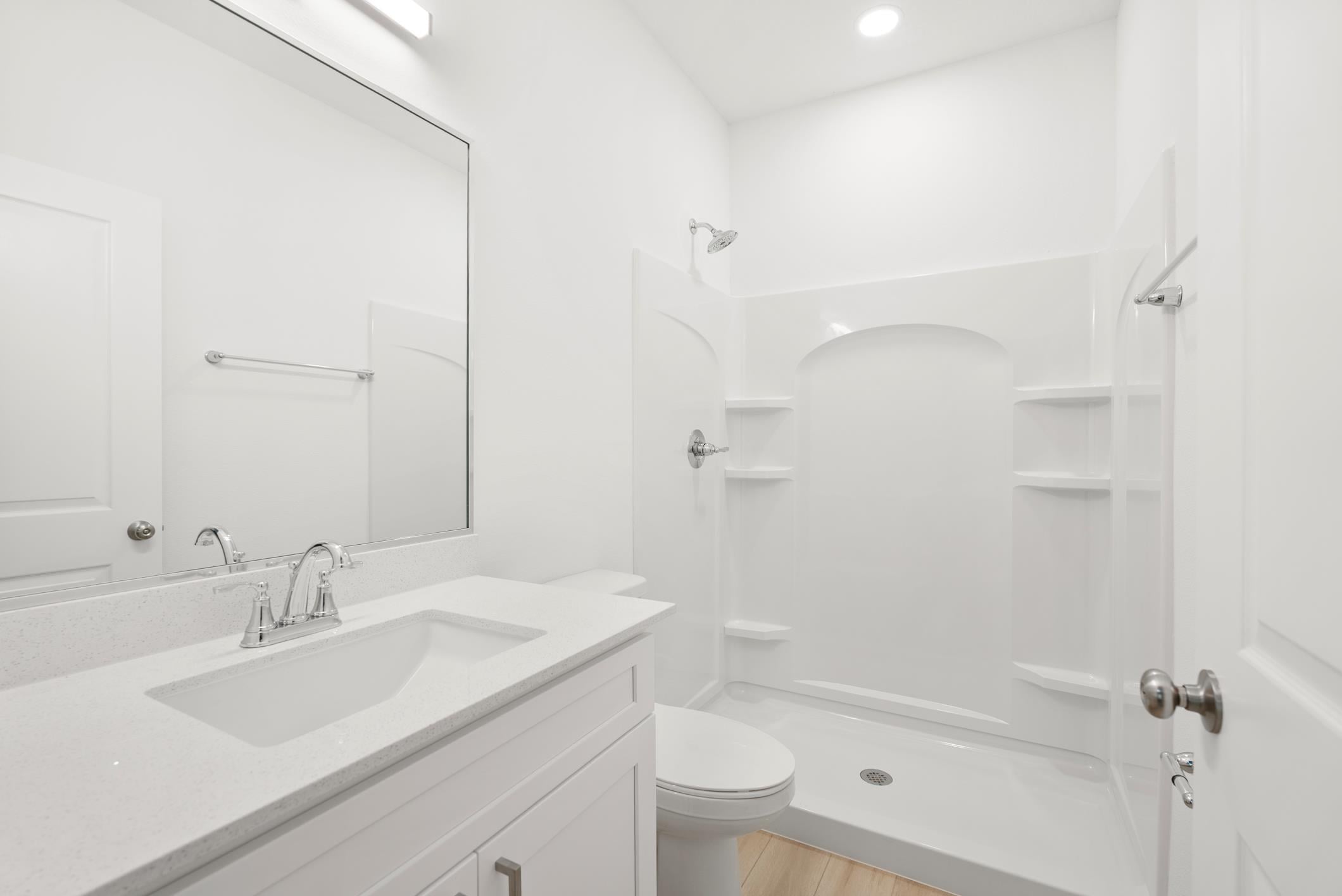 Bathroom with vanity and shower stall